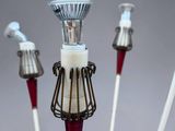four candles that are sitting on top of each other