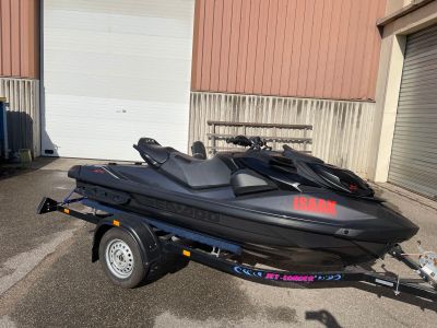 a black jet ski that is parked in front of a building