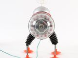 a toy robot that is connected to a wire