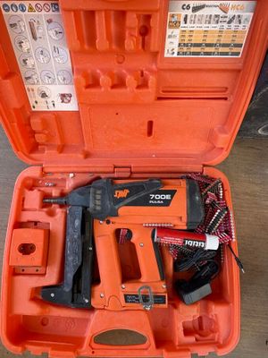 an orange tool case with a stapler, stapler and stapler in it