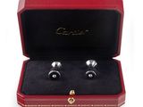 a close up of a pair of cuff watches in a red case
