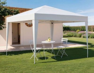 an image of a white tent set up in the grass