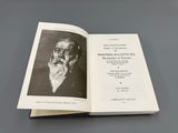 an open book with a picture of a man with a beard