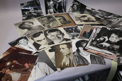 a pile of old photos of men and women