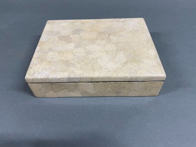 an empty box sitting on top of a table with a blue background