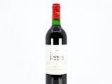 a bottle of wine that is sitting on a table