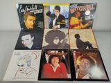 four cd ' s of elvis mitchell ' s album covers