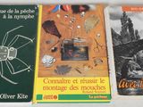 three books on a table with a picture of a bug and other items