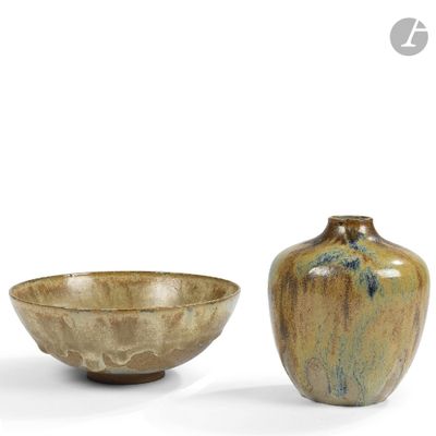 two vases sitting next to each other on a white surface