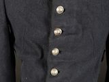 a military uniform with red buttons and a black jacket
