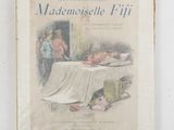 an old book with a picture of a woman and a baby