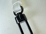 an image of a close up of a black and white purse