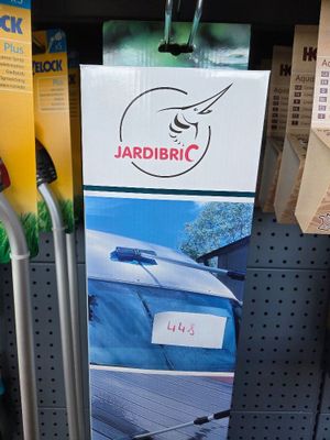 a sign on the side of a rack in a store