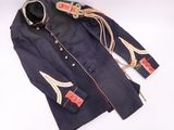 an old military coat with a red cross on it