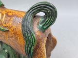 a figurine of a horse that is sitting on a table