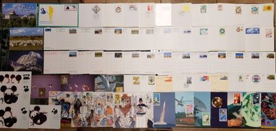 many postcards on the wall of a room