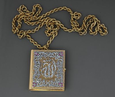 an image of a gold and silver locke with a chain around it