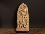 a statue of a woman and a man on a table