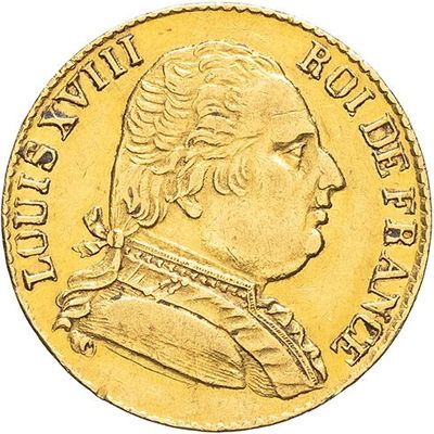 gros plan d'une pièce d'or avec le visage d'un homme