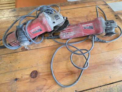 a corded sander on a wooden table next to a corded sander