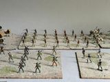 many figurines of different types of soldiers on a table