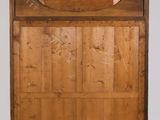 an old wooden door with a sign on the top of it