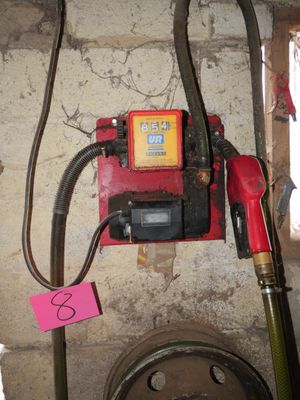 a picture of a gas pump and a hose in a room