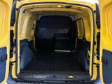 a yellow van that is parked in the snow