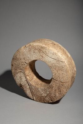 sculpture of a stone donut with a hole in the middle of it