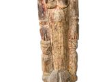an image of a wooden statue of a man on a wooden base