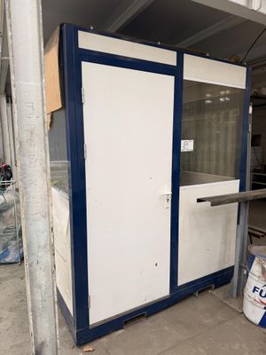 an image of a white and blue cabinet in a garage