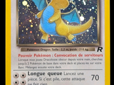 pokemon card with a picture of a yellow dragon flying through the sky