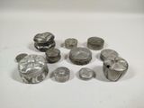 a lot of silver objects on a white surface