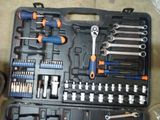 a black case with tools in it sitting on the floor