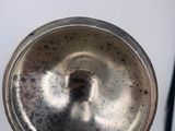 a silver object that is on a table