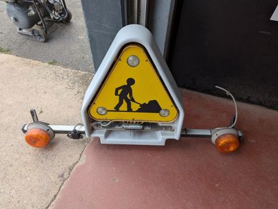 a warning sign on the side of a building