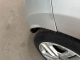 a close up of a car ' s tire on the street