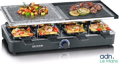 une photo d'un barbecue sur lequel sont disposés plusieurs plateaux de nourriture