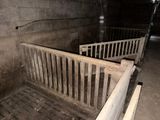 two wooden beds that are in the middle of a room