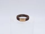 the ring is made of plastic and has a brown cord around it