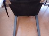 a black chair that is sitting in a room