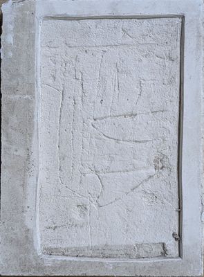 a stone plaque with a picture of a man on it