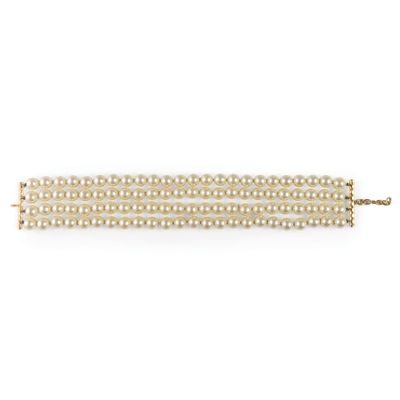a white pearl bracelet with gold clasp