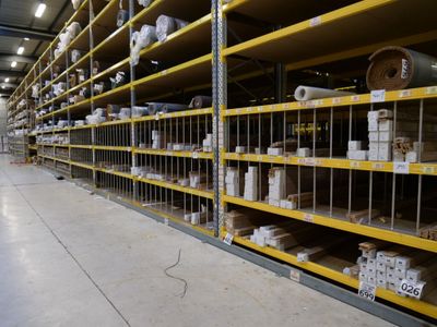a lot of shelves that have rolls of toilet paper on them