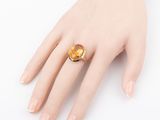 an image of a close up of a person ' s hand with a ring on it