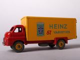 a toy truck that is sitting on a white surface