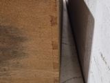 a wooden box that is sitting on the floor