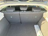 a trunk of a car with the back seats folded down