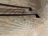 two handles on a wooden table with a wooden surface