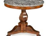 a round table with a marble top on a wooden base